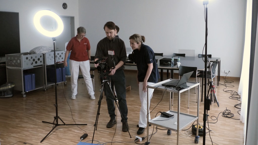 Daniela Jakobsen takes a look at a treatment video together with the videographer